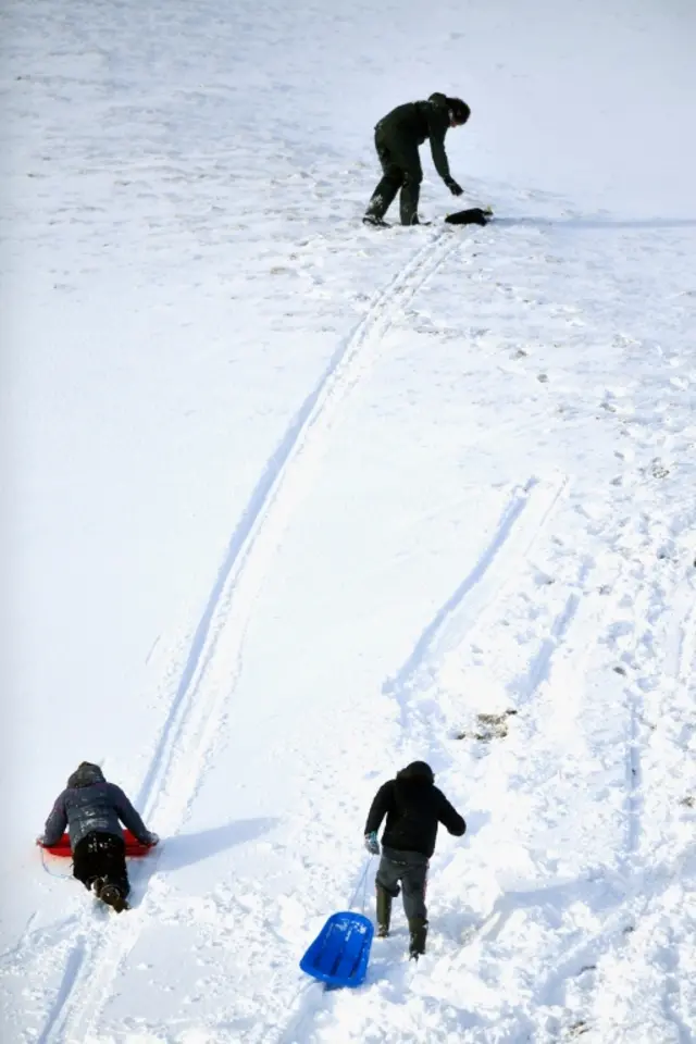 People sledging in Spittal of Glenshee