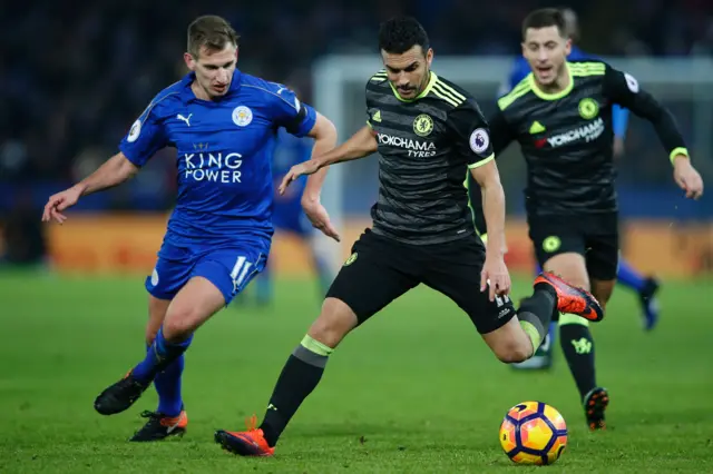 Chelsea"s midfielder Pedro vies with Leicester City"s midfielder Marc Albrighton