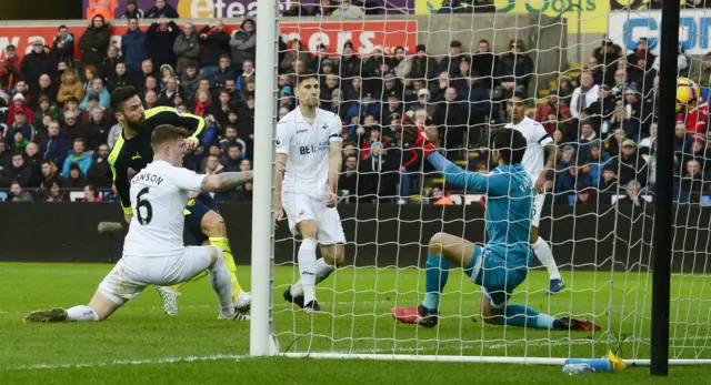 Arsenal"s Olivier Giroud scores their first goal