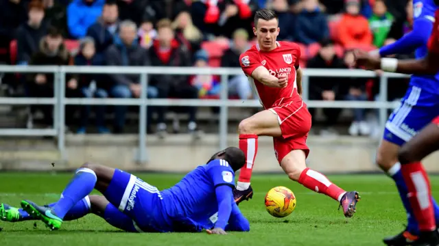 Joe Bryan shoots, blocked by Sol Bamba