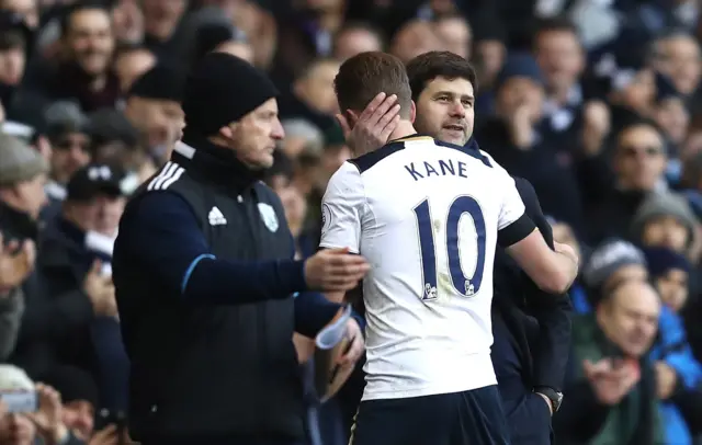 Harry Kane is embraced by his manager