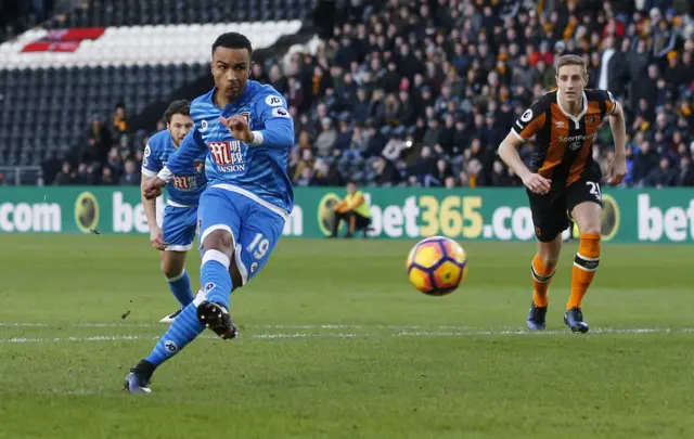 Bournemouth"s Junior Stanislas scores their first goal from a penalty