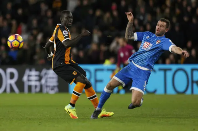 Bournemouth"s Steve Cook in action with Hull City"s Oumar Niasse