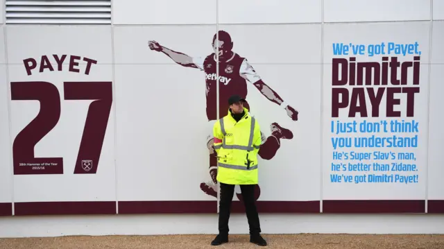 West Ham steward by Dimitri Payet sign