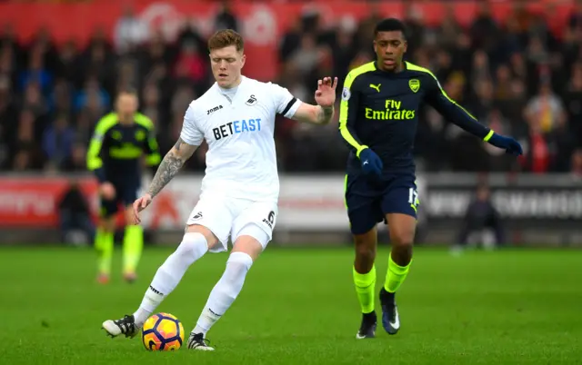 Alfie Mawson of Swansea City passes the ball