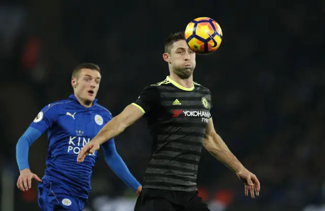 Chelsea"s Gary Cahill in action with Leicester City"s Jamie Vardy