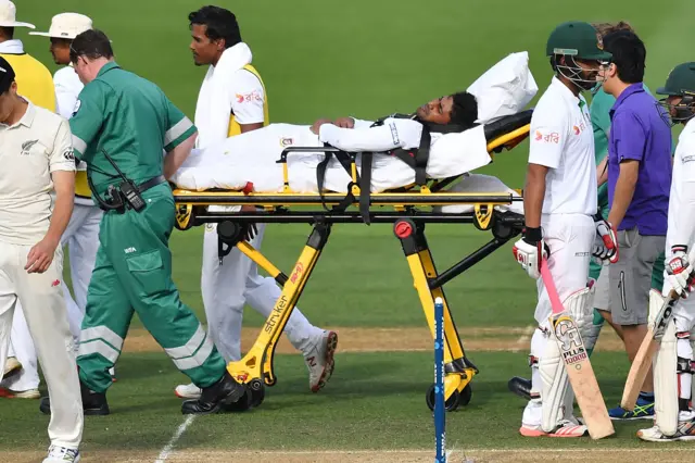 Bangladesh's Imrul Kayes is taken off the pitch on a stretcher