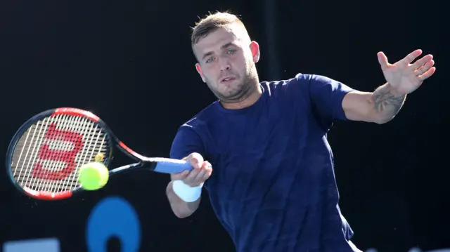 Daniel Evans of Great Britain plays a forehand in his first round match against Facundo Bagnis of Argentina on day one of the 2017 Australian Open at Melbourne Park on January 16