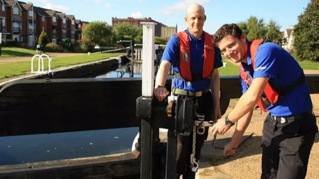 Two volunteer lock keepers