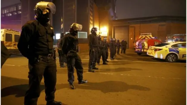 Police outside the jail during the disorder