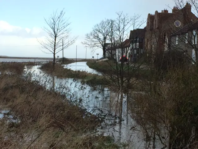 The flooded coast road at Cley