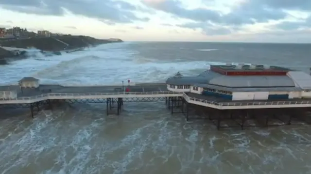 Drone footage, showing aerial view of the pier