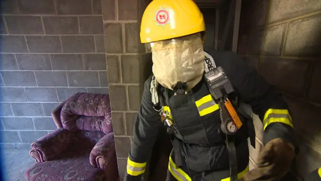 Firefighter wearing breathing apparatus