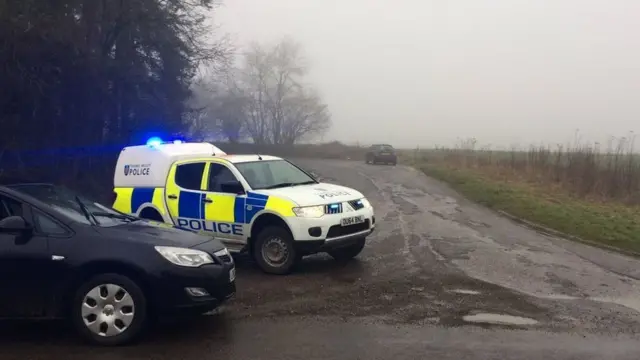 Police vehicles at the scene