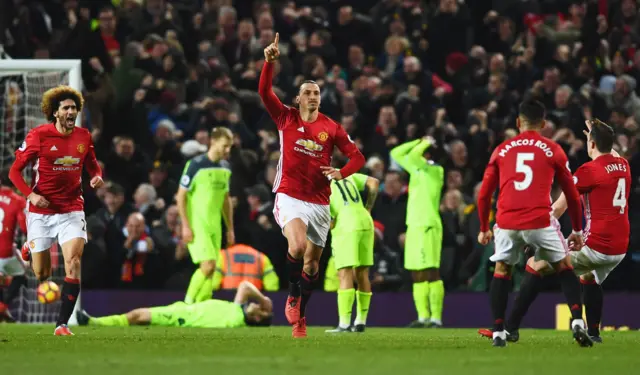 Manchester United celebrate their equaliser against Liverpool