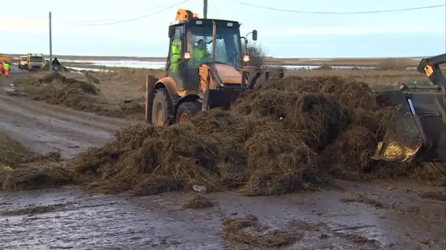 Debris across A149, washed up in storm