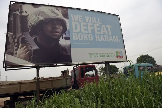 A photo shows a campaign signboad displayed by the ruling All Progressives Congress (APC) to show its readiness to defeat Boko Haram Islamists on assumption office at Ogijo, Ogun State in southwest Nigeria, on July 3, 2015