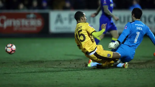 Wimbledon's James Shea saves a shot