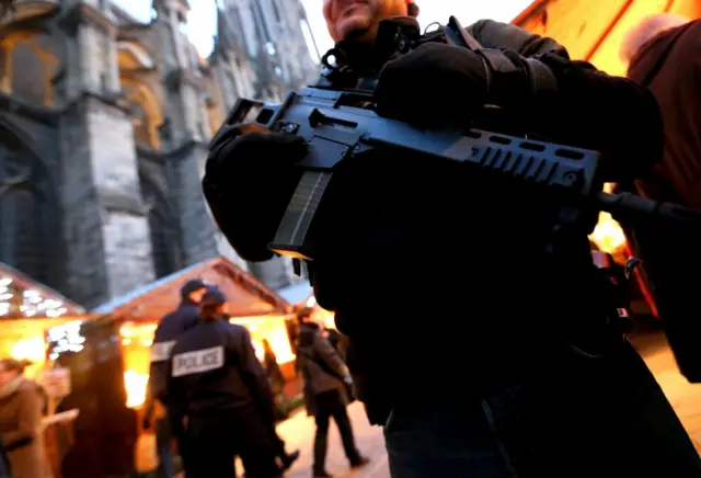 French police officers patrol at the Christmas market in Reims