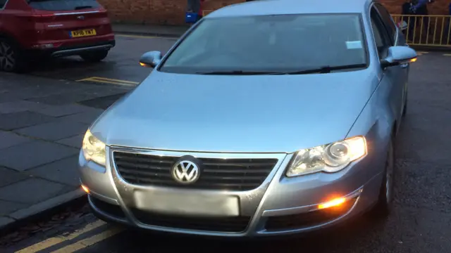 Car parked on double yellow lines