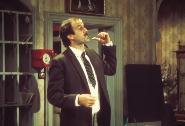 John Cleese as Basil Fawlty in the 1970s sitcom Fawlty Towers