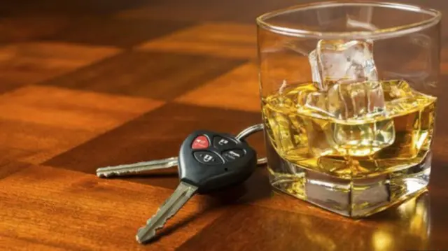 Glass of whiskey and car keys