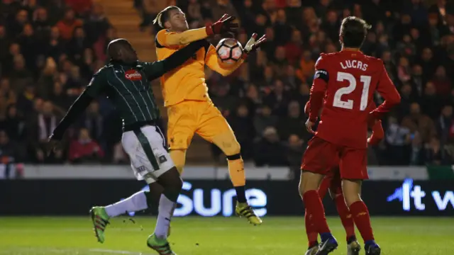 Liverpool's Karius flaps at a shot