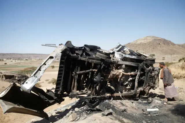 A burned out vehicle in Yemen following an air strike by Saudi-backed coaliton