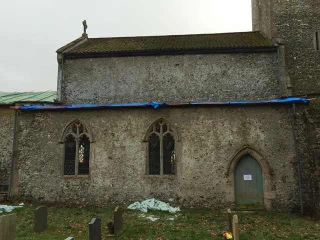 The church, showing the damage to the roof