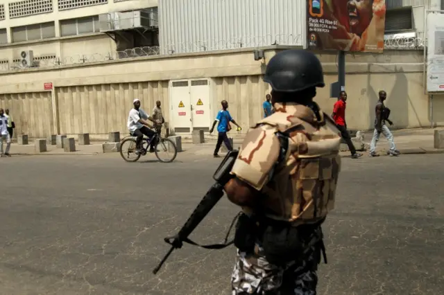 A soldier of Ivory Coast presidential guard stands guard at the port of Abidjan, Ivory Coast January 18, 2017