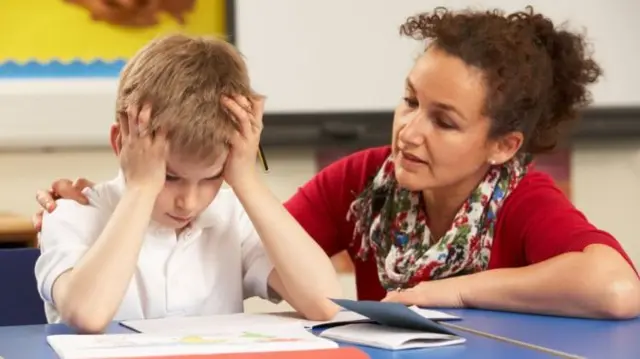 Teacher with pupil