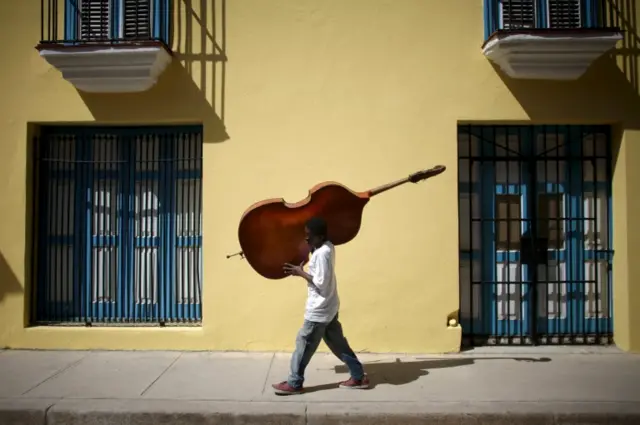 Man carrying a cello