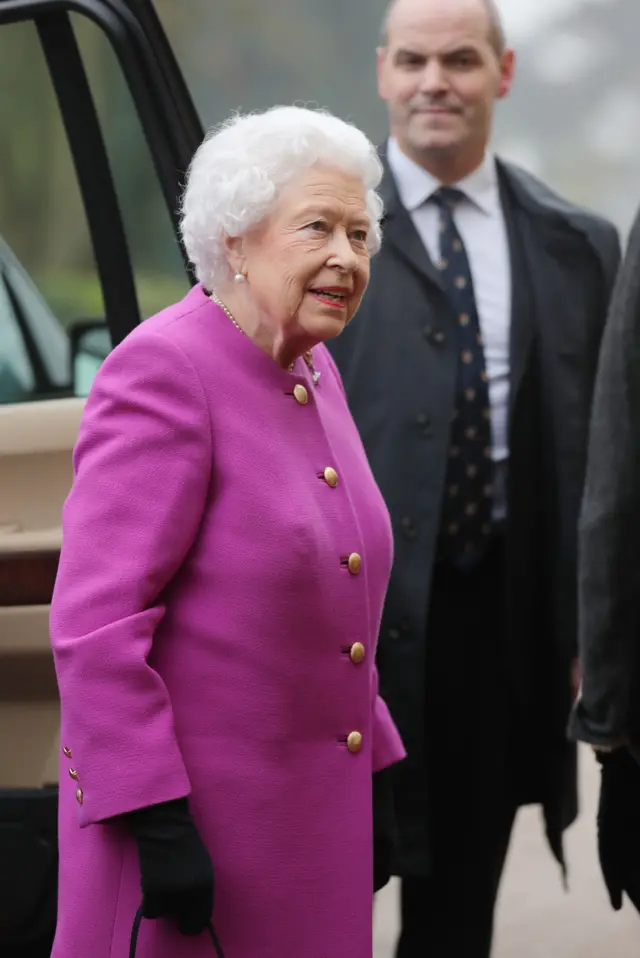 A close up on the Queen, smiling