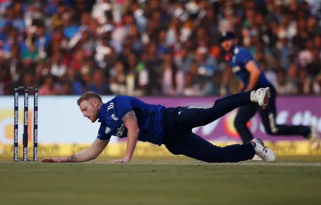 Ben Stokes dives for the ball