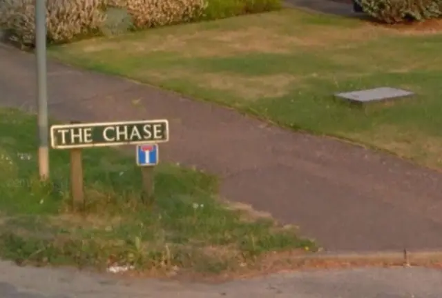 Roadsign for The Chase on grass verge, near pavement