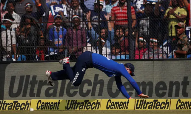 Alex Hales dives to stop the ball