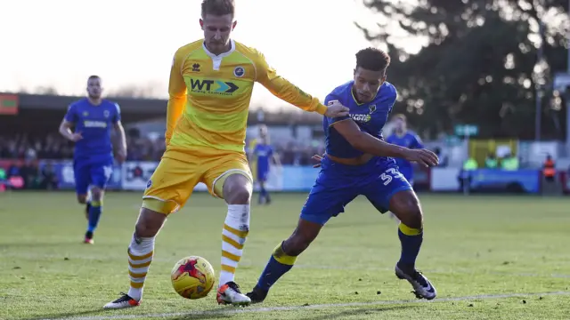 AFC Wimbledon striker Lyle Taylor and Millwall defender Byron Webster