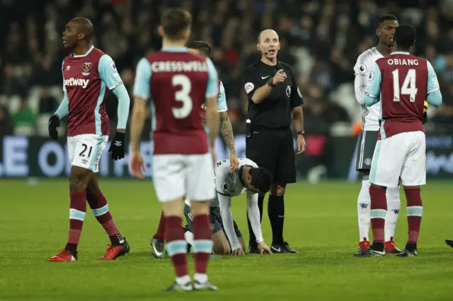 Mike Dean gesture