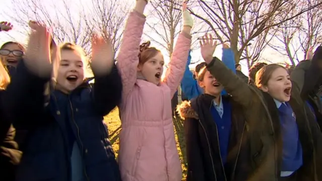 School children cheering