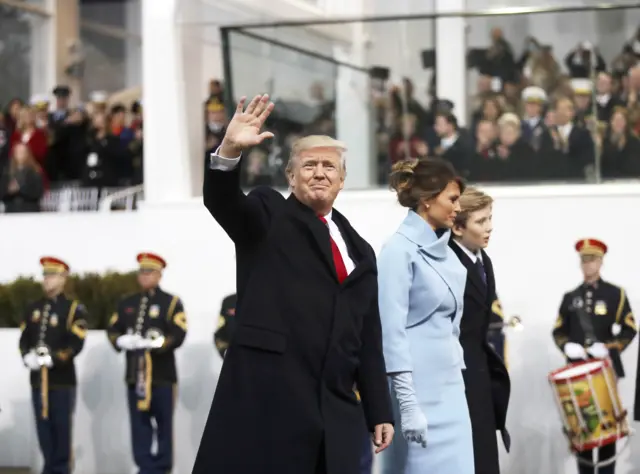 Donald Trump waves with wife Melania during the Inaugural Parade in Washington