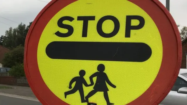 Lollipop crossing sign