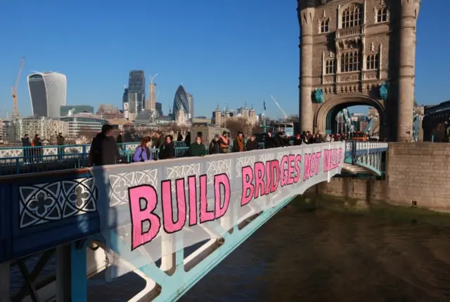 "Build bridges not walls" banner on London's Tower Bridge