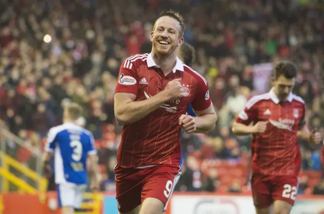 Adam Rooney fires home Aberdeen's third goal at Pittodrie