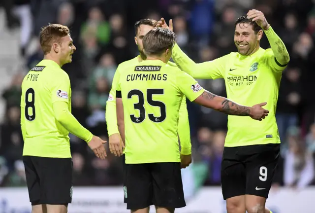 Hibs celebrate one of their eight goals at Tynecastle