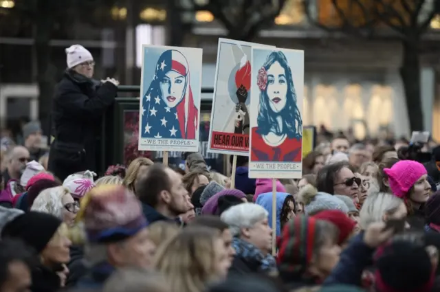 epa05738711 Protesters carry banners and placards during a Women"s March in Stockholm, Sweden, 21 January 2017