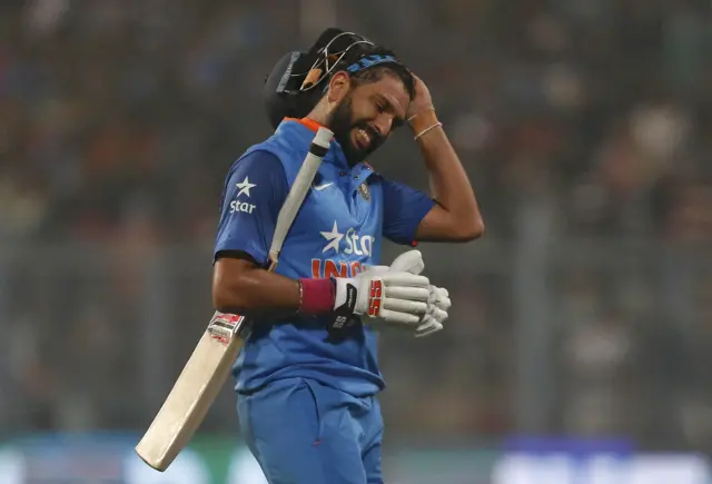 Yuvraj Singh walks off after losing his wicket