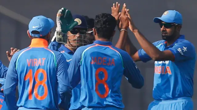 India's players celebrate the wicket of Sam Billings