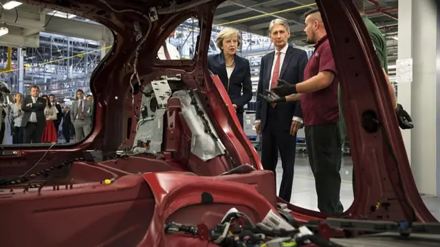 Theresa May and Philip Hammond visit UK car factory