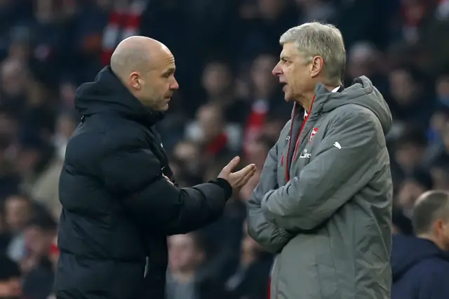 Arsene Wenger and Anthony Taylor