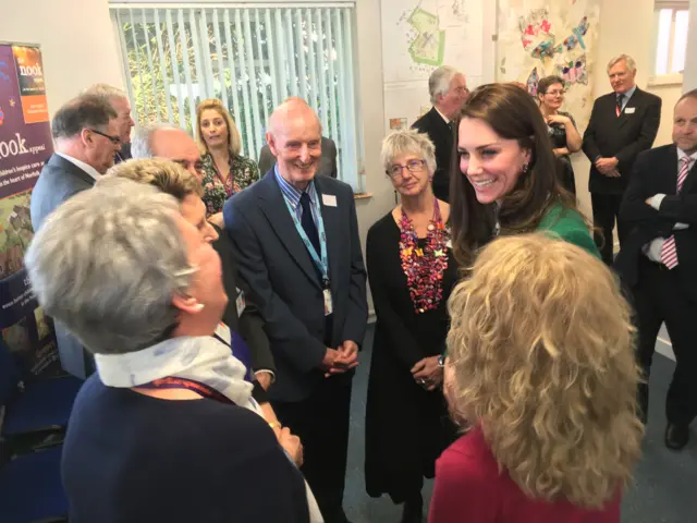 The Duchess of Cambridge talking to staff and volunteers